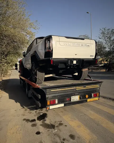 Flatbed transporting GMC Hummer EV