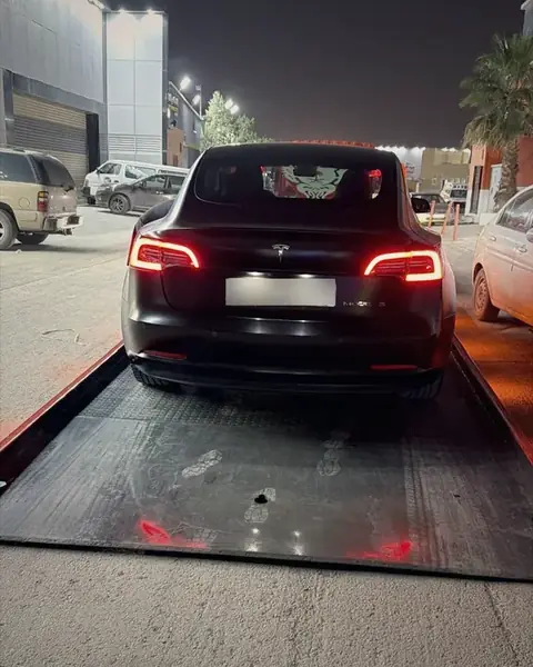 Flatbed transporting Tesla