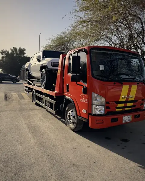 Flatbed transporting GMC Hummer EV