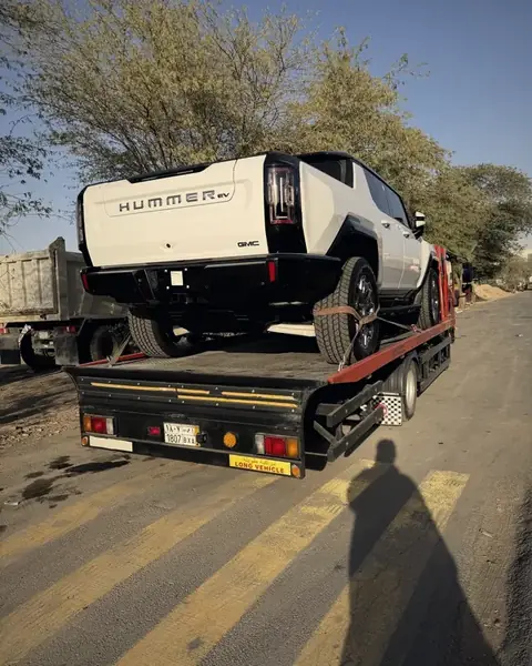 Flatbed transporting GMC Hummer EV