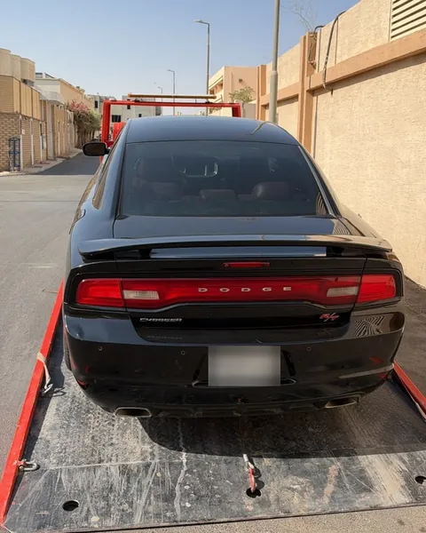 Flatbed transporting Dodge Charger